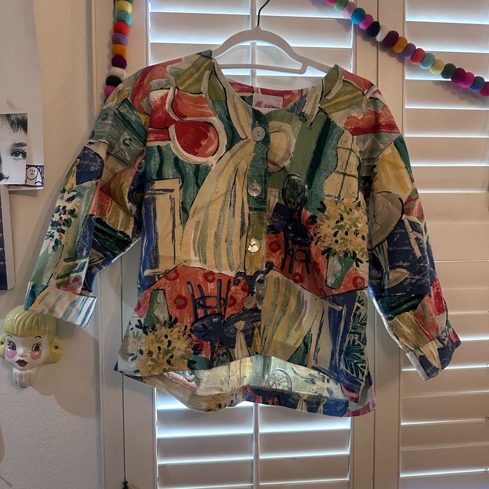 Vintage chair pattern button-up blouse with a whimsical touch.